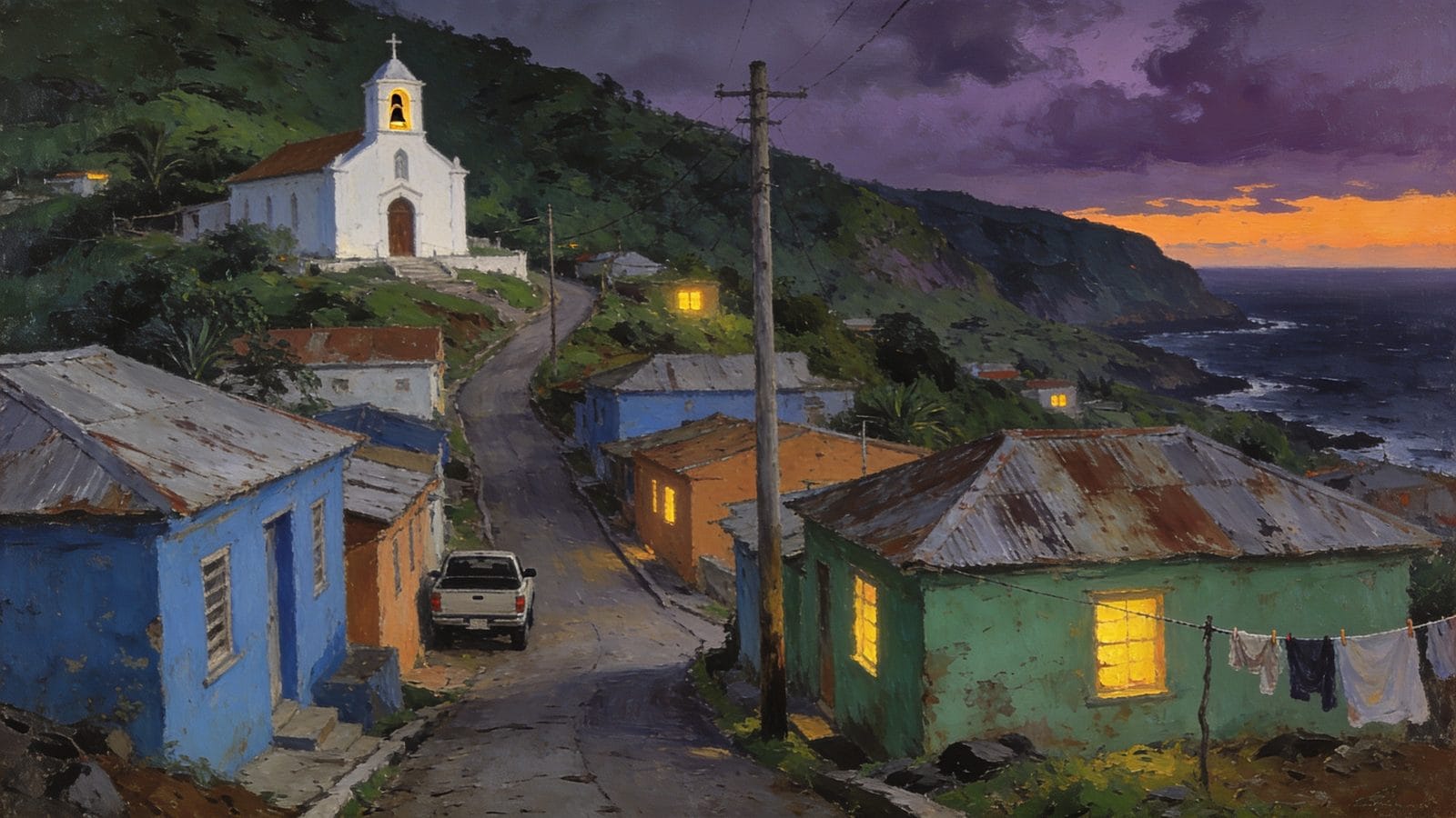 A steep road of salt-faded pastel houses below a white hilltop church in a Caribbean island town at dusk, the dark sea beyond